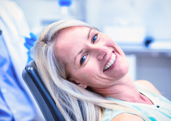 Portrait of female patient smiling in dental clinic Harmonização orofacial